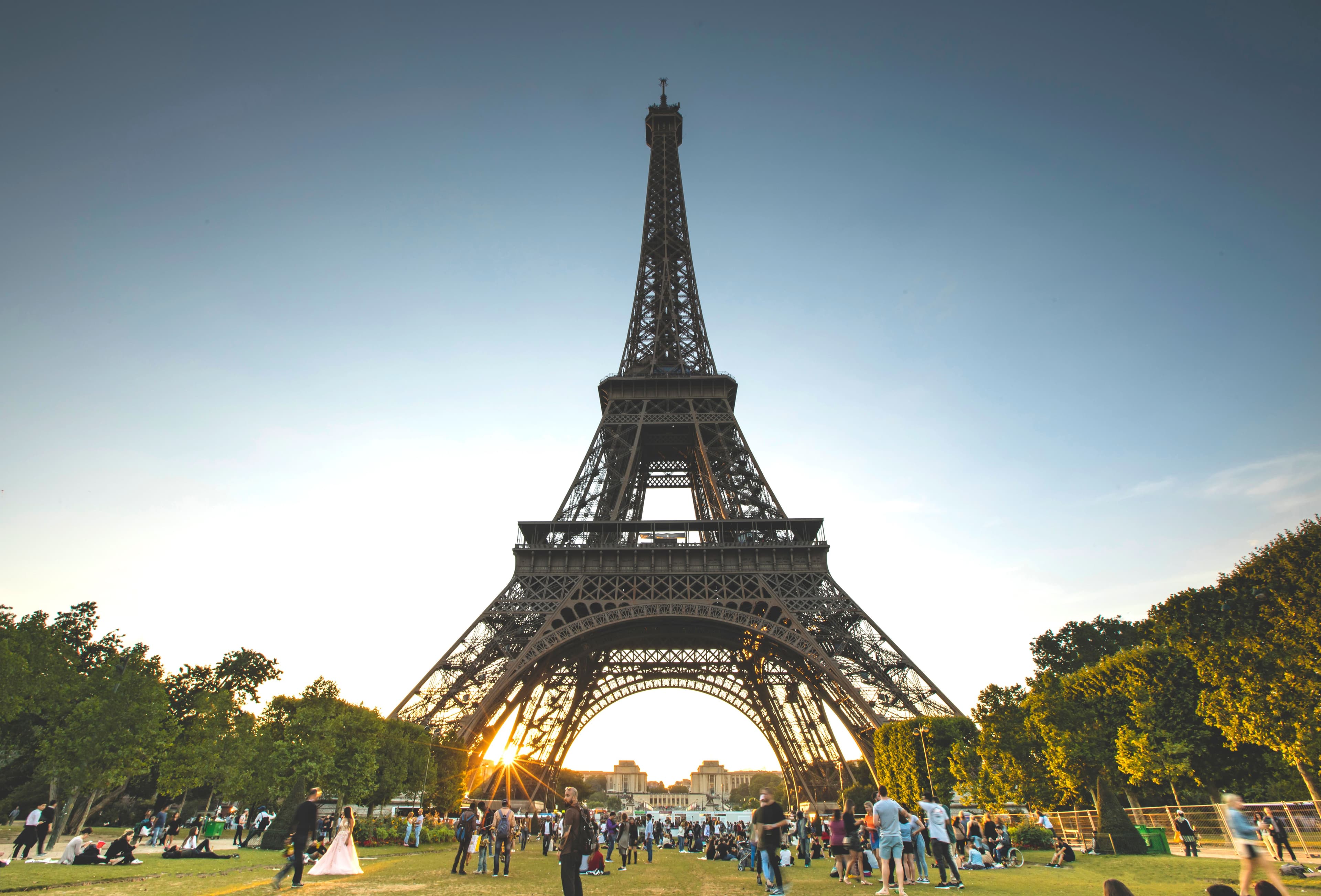 The Eiffel Tower at sunset seen from the Champ de Mars in Paris